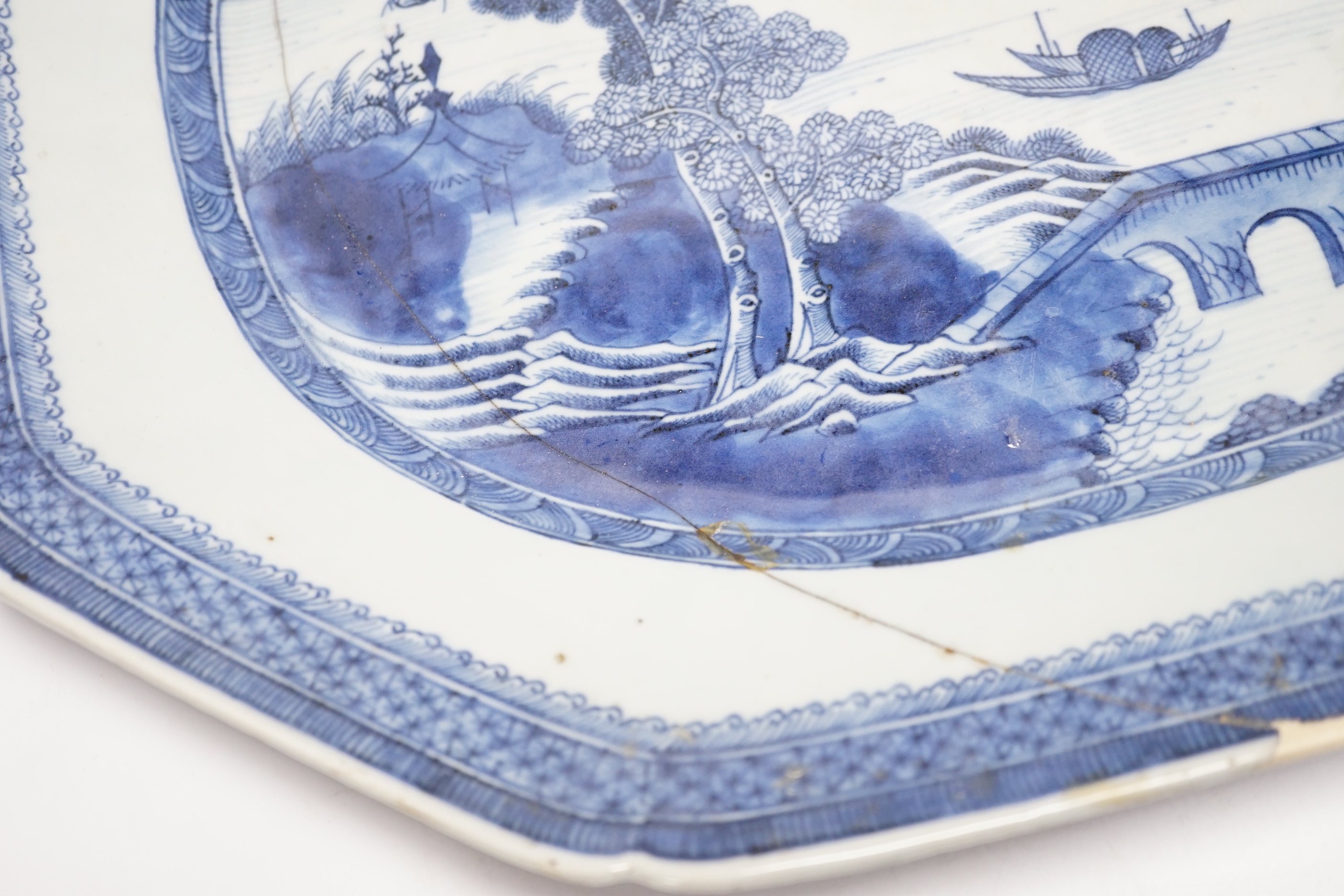 An early 19th century Chinese export blue and white dish, 51cm (a.f.)